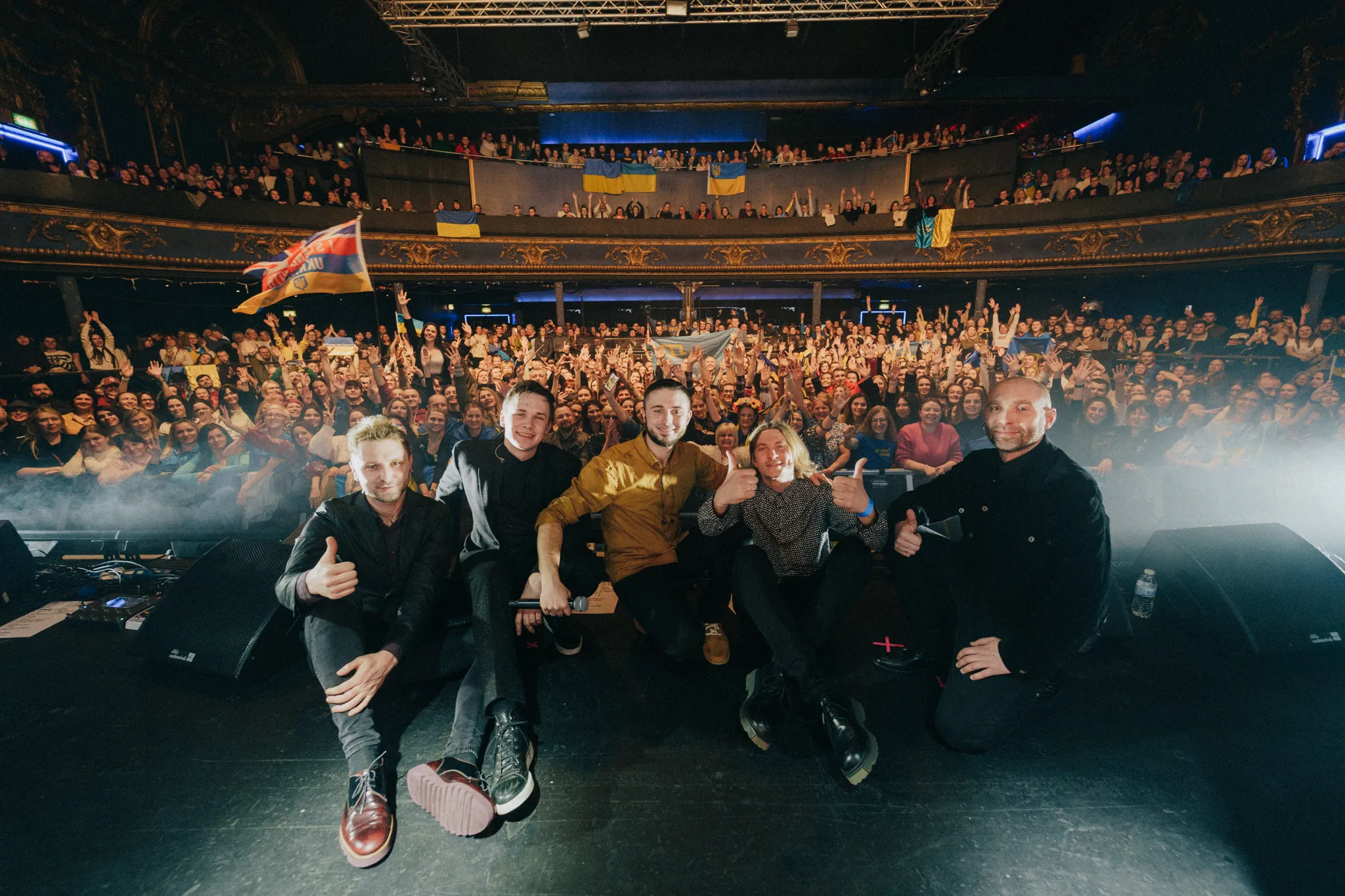 Antytila poses with a packed crowd at a concert venue during their U.S. tour