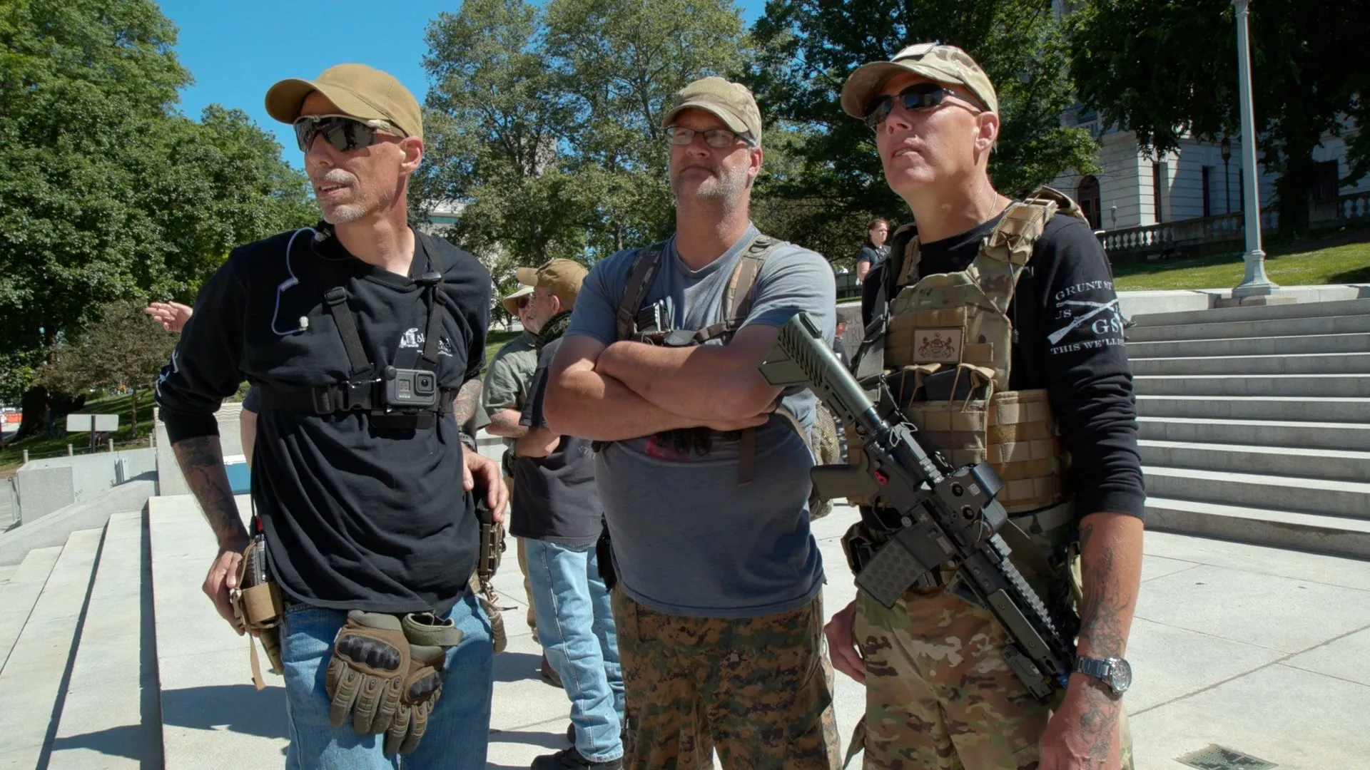 Militia members gather on the steps of the state capitol